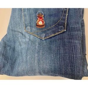 Upcycled, Paper, Denim and Cloth jeans. With embroidered lantern.